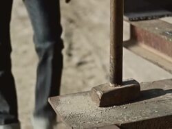 Man hammering outside Stock Footage