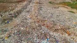 Garbage at a rubbish dump in a landfill site, pollution, Global warming Stock Footage