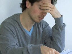 Ms pan of a man sorting out finances, UK Stock Footage