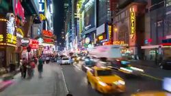 Time Lapse of pedestrians and cars at 42 Street intersection, zoom out Stock Footage