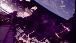 Spacewalking astronauts finishing robot arm repair Instructional Video