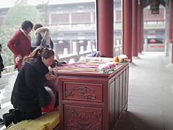 MS Shot of People of buddhists pray in temple / Xi'an, Shaanxi, China Stock Footage