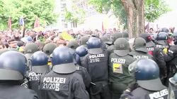 Police and anti-capitalist protesters are engaged in a standoff near the ECB headquarters Instructional Video