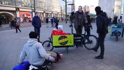 Students cycle around city giving gifts to homeless Instructional Video