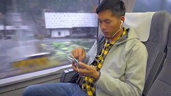 A Man using smartphone in train Stock Footage