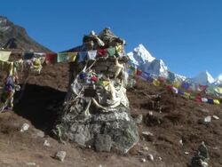 Monument with Buddhist prayer flags in the Himalayas. Stock Footage