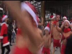 Hundreds of scantily-clad Santas hit the cold streets of central Budapest, Hungary on Sunday to take part in a run to raise money for children in need. News Clip
