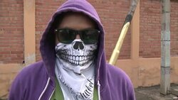Masked artist protests violence in Honduras News Clip