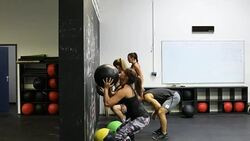 Friends exercising with medicine balls at gym Stock Footage