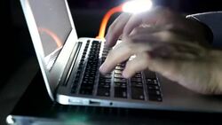 Typing on computer keyboard at late night Stock Footage