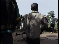 Militia patrolling streets, refugees, aid workers help dig graves News Clip