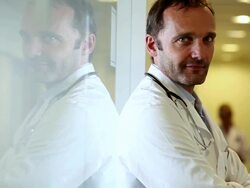 MS CU PAN Portrait of doctor and two female doctors walking alongside / Brussels , Brabant, Belgium Stock Footage