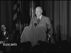1948: NATIONAL ADVERTISERS CONVENTION: President of Columbia University General Dwight D. Eisenhower shaking hands by stage, PAN Business audience standing, applauding. Instructional Video