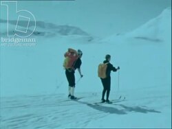 Cross-country skiing on the Jotenheimen Mountains. Skiers reach the Galdhopiggen and rest. Norway 1970s Stock Footage