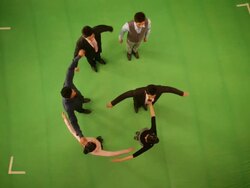 Business people forming alphabet G Stock Footage