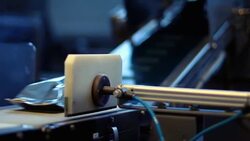 Powder milk foil package move on conveyor belt. Closeup of packs on food production line. Food plant. Food processing industry. Process of packaging food products. The products on conveyor belt. Food technology Stock Footage