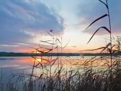 HD Motion Time-Lapse: Lake At Sunset Stock Footage