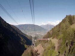 Overhead cable car moving up from intermediate station Stock Footage