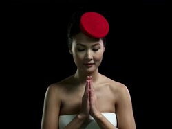 Woman wearing red hat bowing Stock Footage
