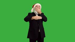adult senior beard man shows a wonderful focus  in a hat santa claus  on a green background Stock Footage