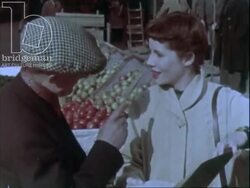 Young lady battles the rush hour crowd and asks for directions from a barrow boy. She walks among the backstreets. London C.1960 Stock Footage