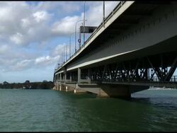 Metal into Horizon: Underneath Bridge Spanning Harbor Stock Footage