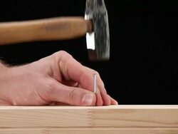 CU, Lockdown, man successfully hammering in a nail Stock Footage