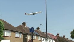 Passenger Plane Flying Over Residential Houses News Clip