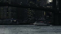 Urban scene. Boats sailing under the bridge and past skyscrapers Stock Footage