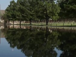 OKC Bombing Memorial Reflecting Pool and Field of Empty Chairs Stock Footage