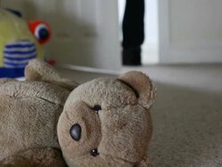 Teddy bear, man leaving room. Stock Footage