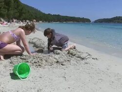 MS Children playing at beach in holiday / Puerto Pollenca, Mallorca, Balearic Islands, Spain Stock Footage
