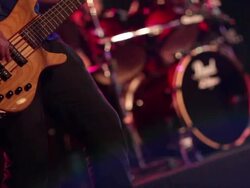Man Playing Bass Guitar at Concert in Local Bar Stock Footage