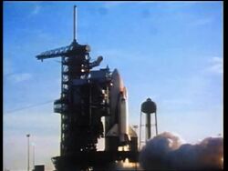 1970s wide shot cloud of smoke rising around space shuttle on launch pad / educational Stock Footage