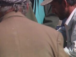 MS TU Civilians interacting with military personnel on sidewalk / Kabul, Kabul, Afghanistan Stock Footage
