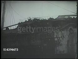 1943: ALEUTIAN ISLANDS CAMPAIGN: KISKA INVASION: VS Allied forces (could be United States or Canadian army) walking across deserted beach, abandoned Japanese ship moored on beach, damaged ships & aircrafts. WWII, World War II, Pacific Front Instructional Video