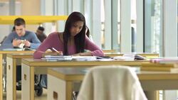 LS DS Female Student Writing An Assignment Stock Footage