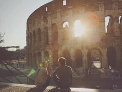 Couple by the Coliseum at sunset Stock Footage