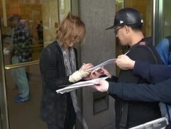 Japanese musician, songwriter, composer and record producer Yoshiki (leader and co-founder of the heavy metal band X Japan) arriving at SiriusXM Satellite Radio Stock Footage
