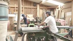 Two craftsmen are cutting wood for making furniture Stock Footage