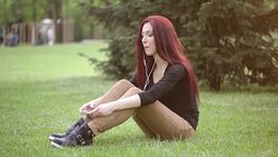 Young woman listening to music Stock Footage