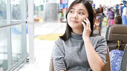 Woman use social media for communication at the airport Stock Footage