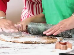 CU PAN Grandmother and Granddaughter Baking Gingerbread Men Cookies in Kitchen / Richmond, Virginia, USA Stock Footage
