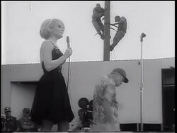 B/W 1967 Bob Hope + Joey Heatherton dancing wackily on stage / USO show / Vietnam War Stock Footage