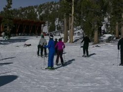 Heavenly Valley skiers near mountain top lodge Stock Footage