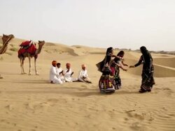 Three rajasthani women dancing on desert, Sam Desert, Jaisalmer, Rajasthan, India Stock Footage