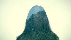 Multiple Exposure of woman and mountain in snow Stock Footage
