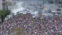 CLEAN : Venezuela police fire tear gas at protest of thousands News Clip