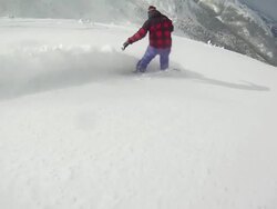 A snowboarder carving a mountain in winter. - Slow Motion - Model Released - HD Stock Footage