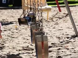 MS Little girl playing  on swing in park / Toronto, Ontario, Canada Stock Footage